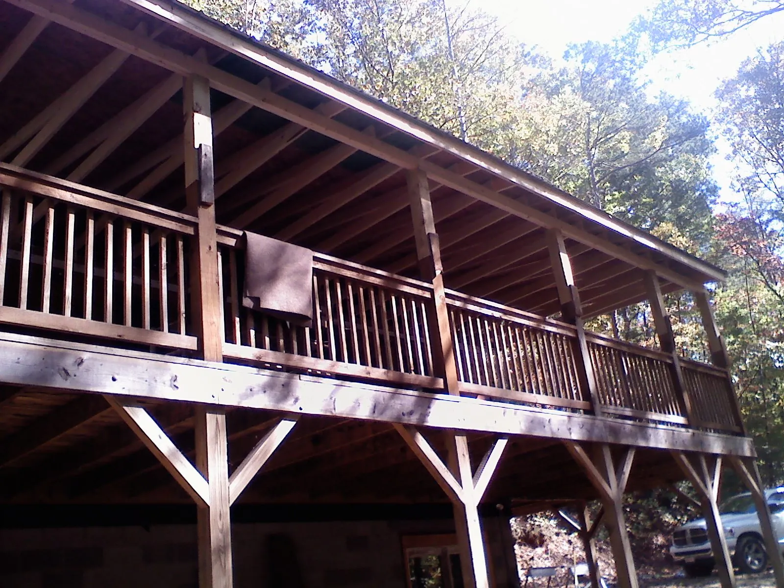 Timber framing under a new elevated porch and deck — Roof Leak Repair in New Berlin by Roofing Brothers